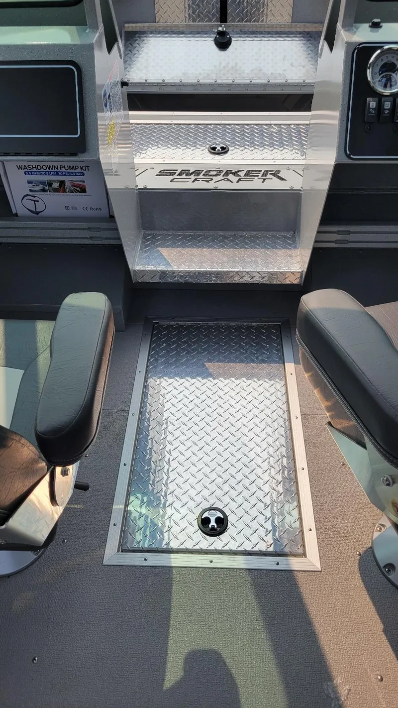 Slide: The Image of 2026 Smoker Craft Phantom 18 X2 interior with diamond plate flooring and seating. - 8