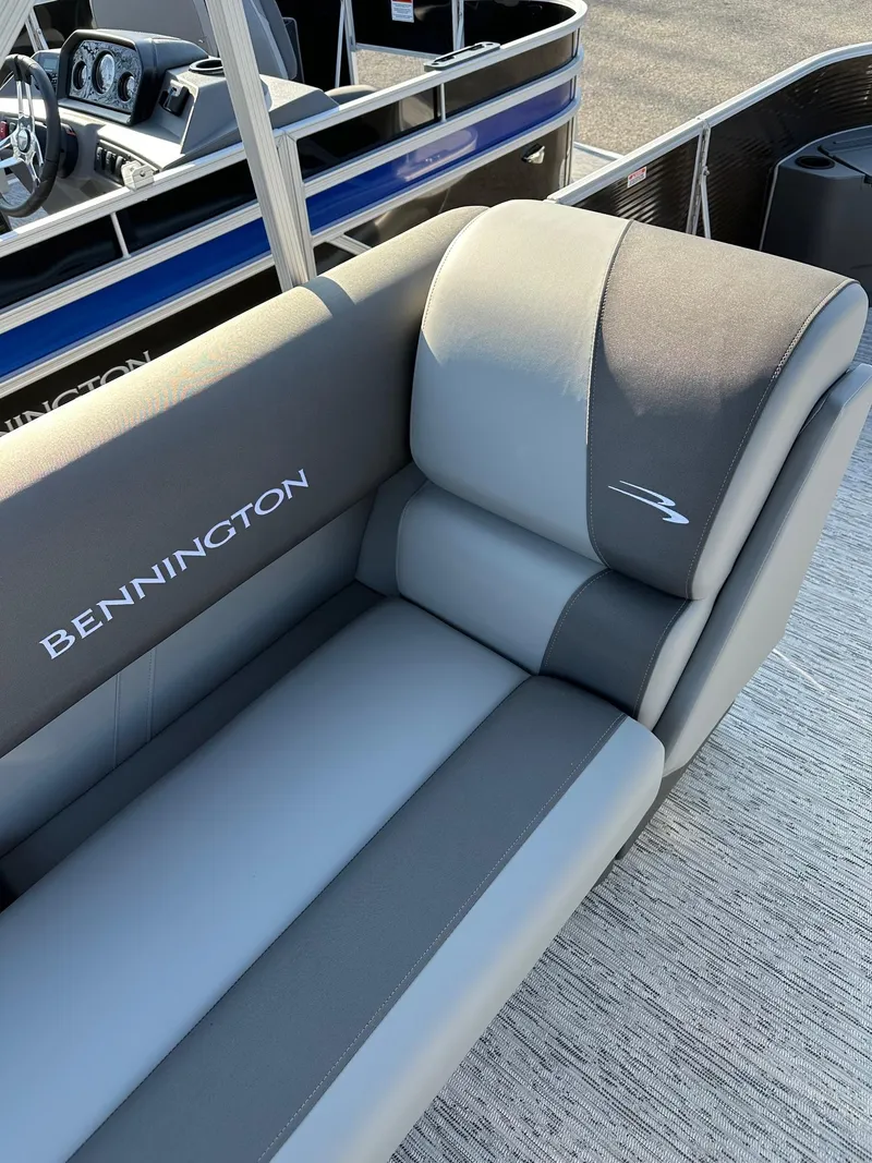 Slide: The Image of 2025 Bennington 188 SS Family Fish Pontoon seating, featuring sleek gray upholstery. - 20