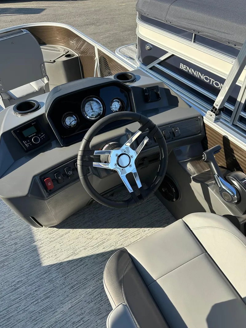 Slide: The Image of 2025 Bennington 188 SS Family Fish Pontoon dashboard with steering wheel and controls. - 21