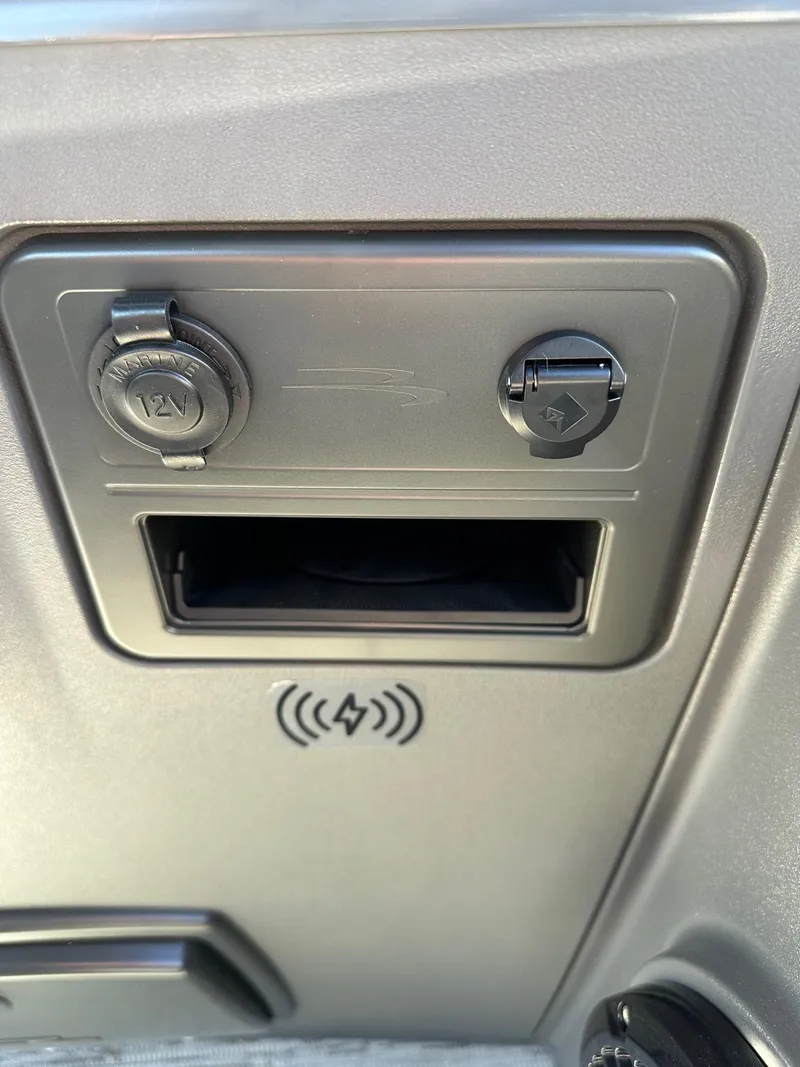 Slide: The Image of 2025 Bennington 188 SS Family Fish Pontoon dashboard with 12V and USB ports. - 25