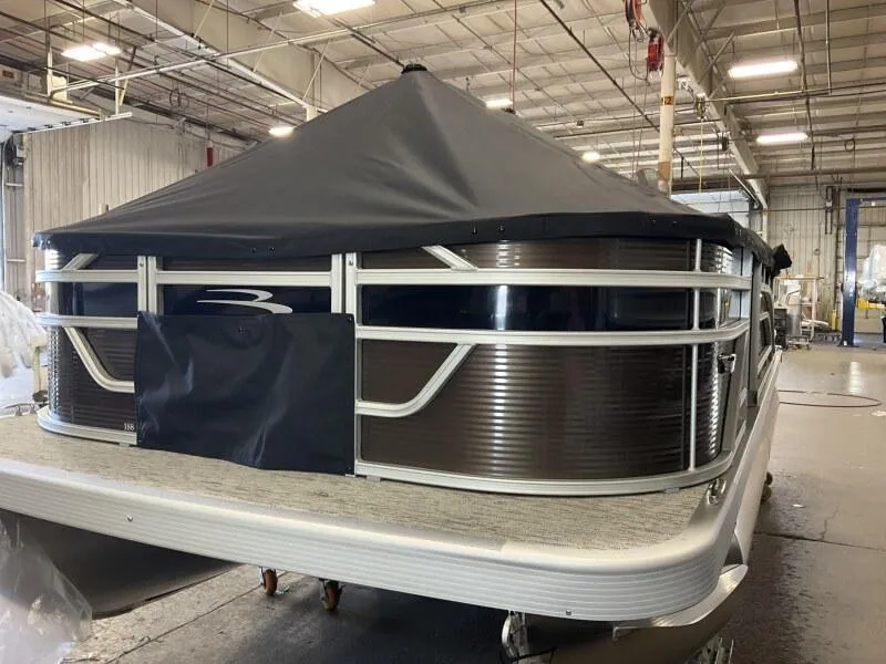 Slide: The Image of 2025 Bennington 188 SS Family Fish Pontoon in stock, covered and displayed indoors. - 28