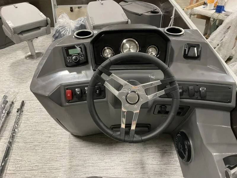 Slide: The Image of 2025 Bennington 188 SS Family Fish Pontoon dashboard with steering wheel and controls. - 3