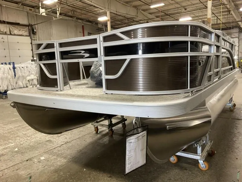 Slide: The Image of 2025 Bennington 188 SS Family Fish Pontoon in stock, displayed in a warehouse setting. - 32