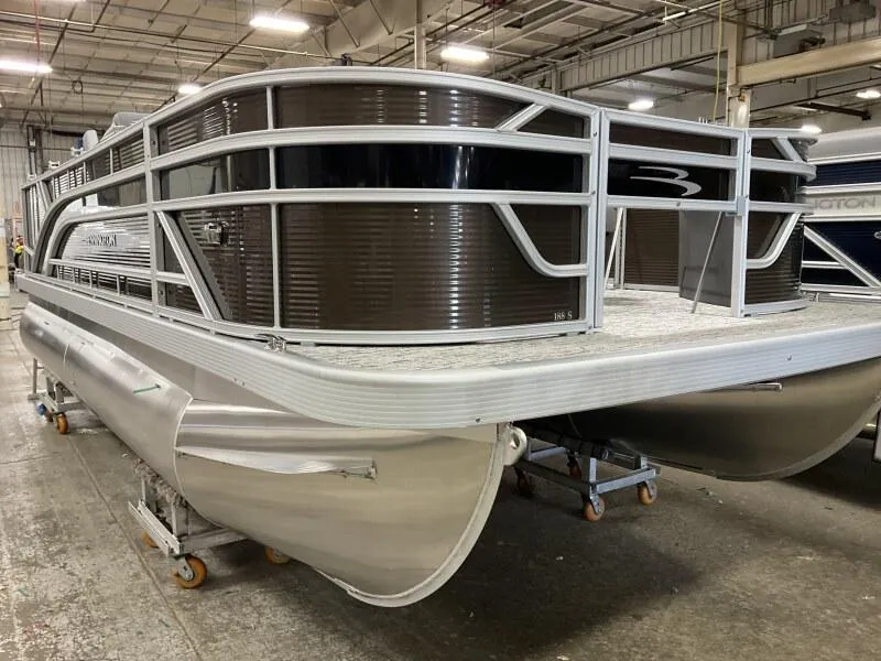 Slide: The Image of 2025 Bennington 188 SS Family Fish Pontoon in stock, displayed in a warehouse setting. - 33