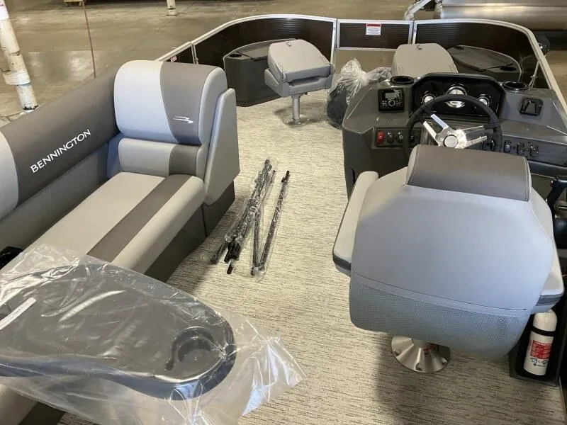 Slide: The Image of 2025 Bennington 188 SS Family Fish Pontoon interior with seating and steering console. - 34
