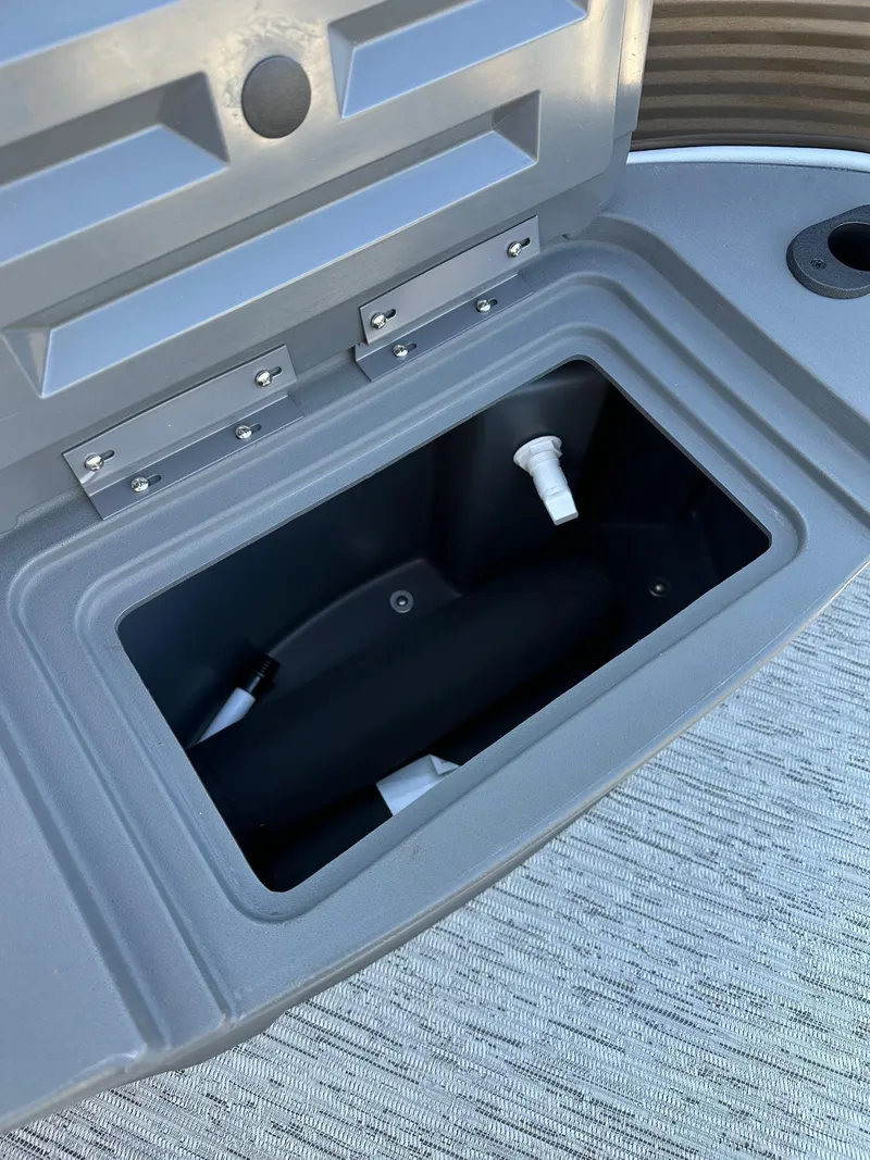 Slide: The Image of Open storage compartment on 2025 Bennington 188 SS Family Fish Pontoon boat. - 39