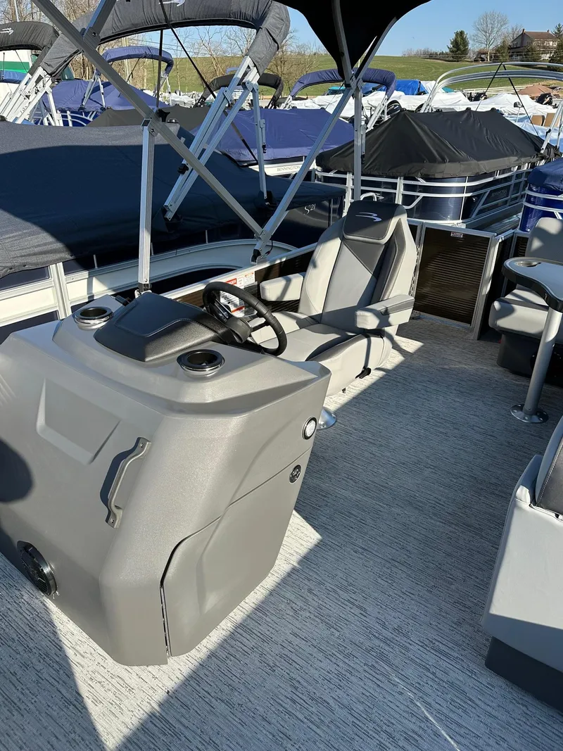 Slide: The Image of 2025 Bennington 188 SS Family Fish Pontoon interior with steering console and seating. - 40