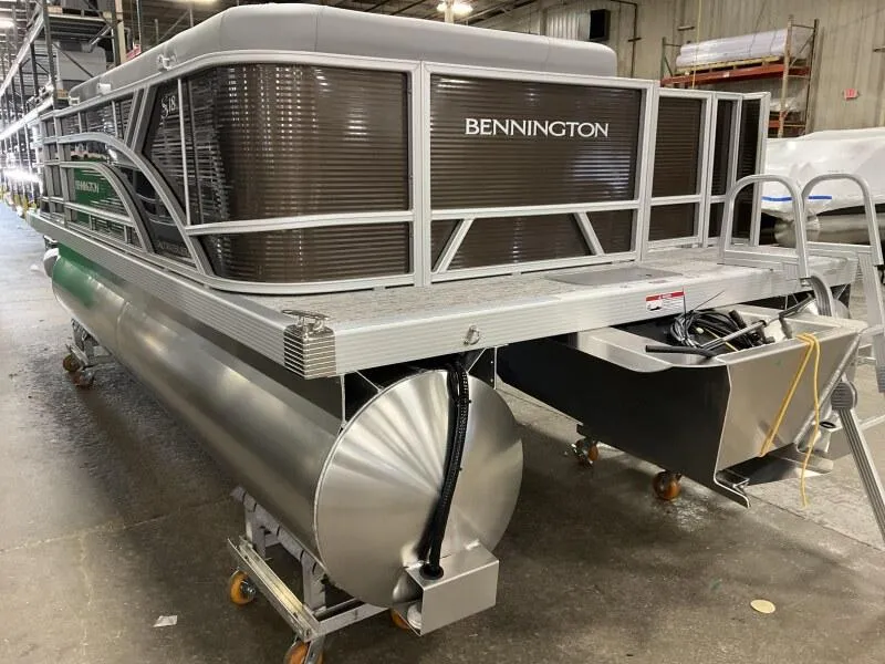 Slide: The Image of 2025 Bennington 188 SS Family Fish Pontoon in stock, displayed in a warehouse setting. - 9
