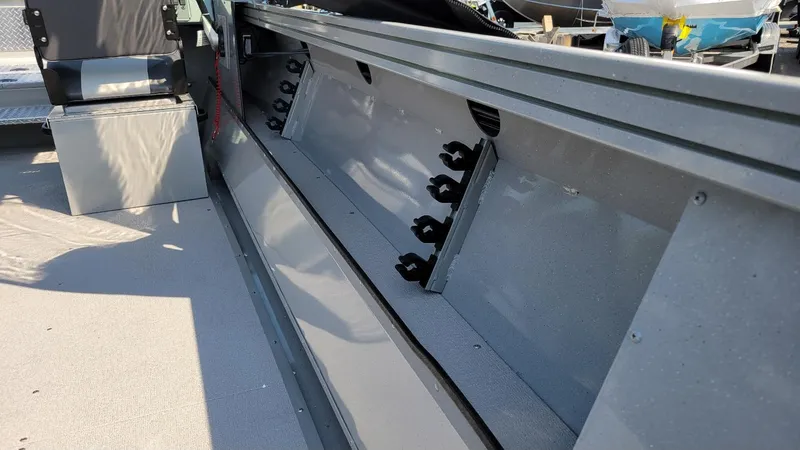 Slide: The Image of 2026 Smoker Craft Pro Sportsman 2072 interior with rod holders and seating. - 12