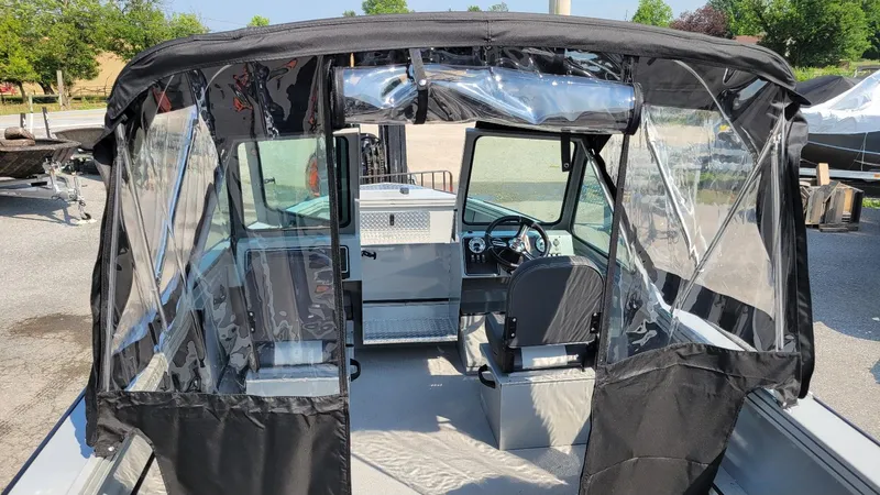 Slide: The Image of 2026 Smoker Craft Pro Sportsman 2072 dual console boat with canopy and Yamaha 150 engine. - 17