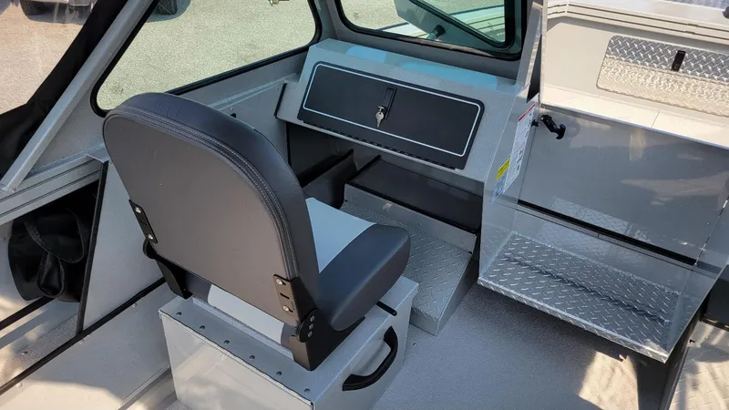 Slide: The Image of 2026 Smoker Craft Pro Sportsman 2072 interior with dual console and seating. - 9