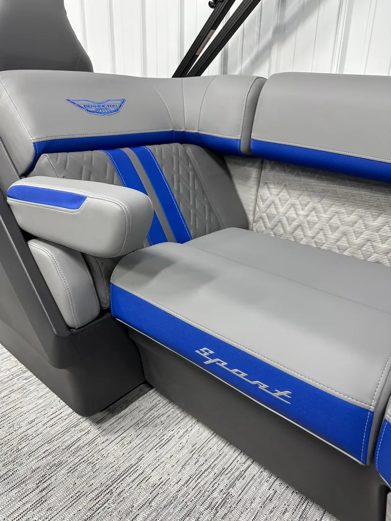 Slide: The Image of 2025 Bennington 22 MFB Tritoon interior with gray and blue sport seating. - 11