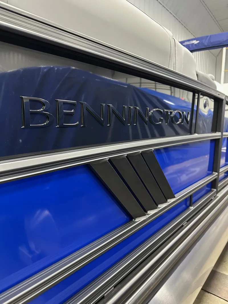Slide: The Image of 2025 Bennington 22 MFB Tritoon, blue exterior detail, showcasing sleek design and branding. - 23