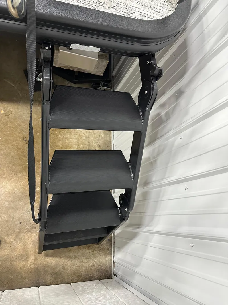 Slide: The Image of 2025 Bennington 22 MFB Tritoon ladder detail in storage facility. - 27