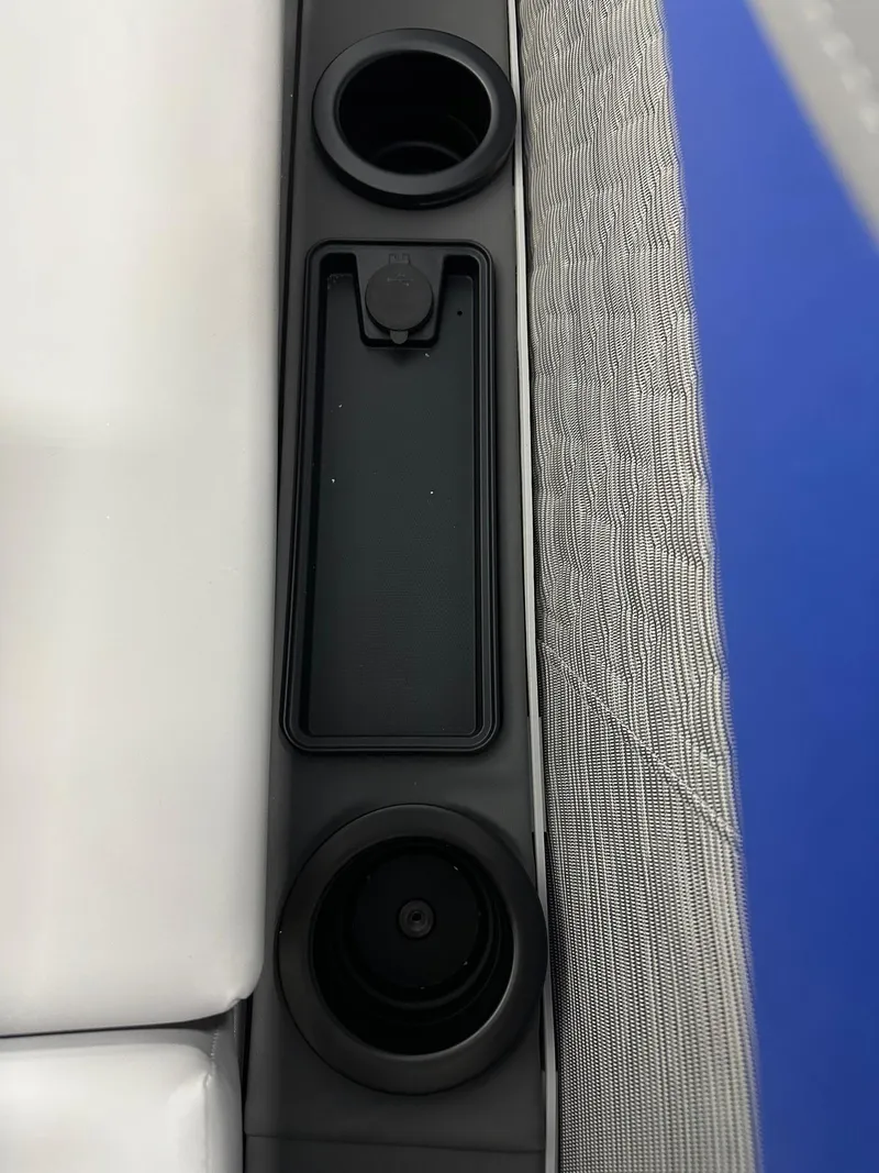 Slide: The Image of Cup holders and storage on 2025 Bennington 22 MFB Tritoon boat bench. - 31