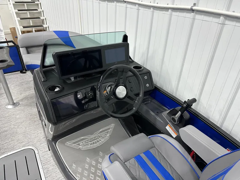 Slide: The Image of 2025 Bennington 22 MFB Tritoon helm with modern controls and dual screens. - 38