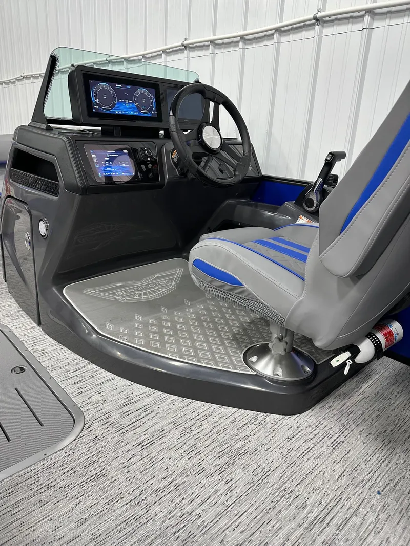 Slide: The Image of 2025 Bennington 22 MFB Tritoon helm with modern controls and comfortable seating. - 43