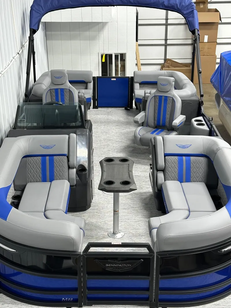 Slide: The Image of 2025 Bennington 22 MFB Tritoon with blue and gray seating, in stock. - 44