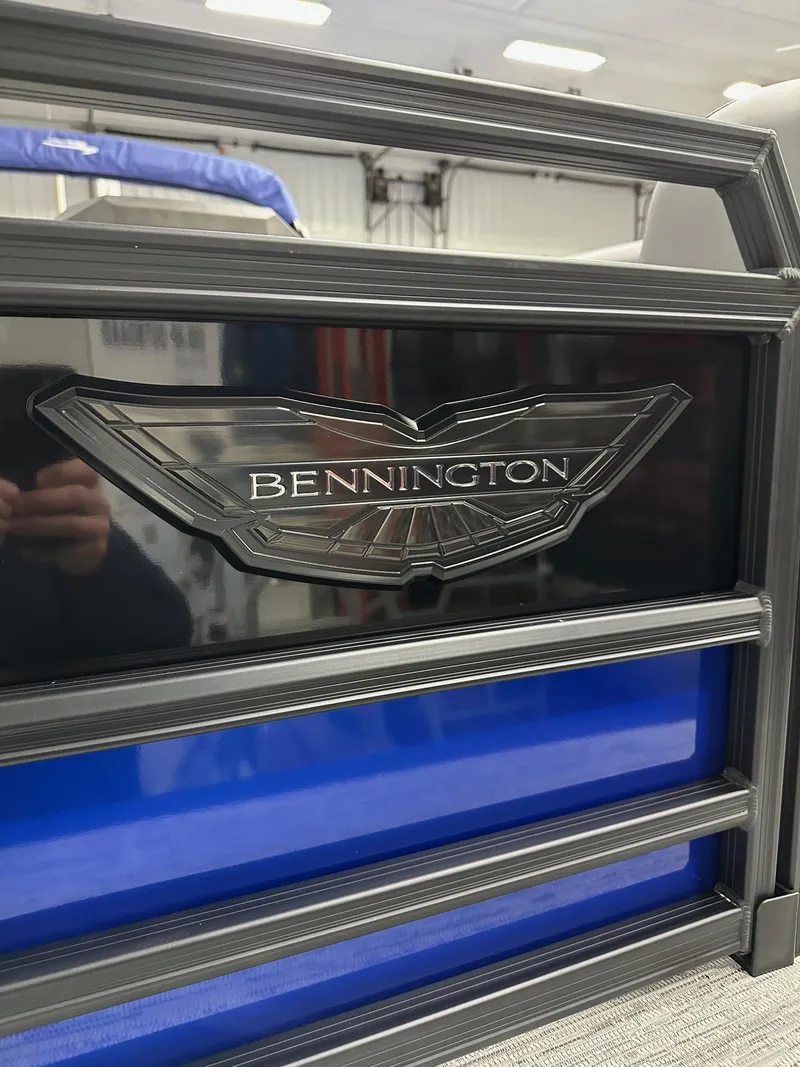 Slide: The Image of 2025 Bennington 22 MFB Tritoon logo detail in showroom setting. - 45