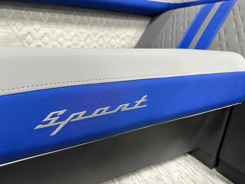 Slide: The Image of 2025 Bennington 22 MFB Tritoon interior with blue and gray sport seating detail. - 5