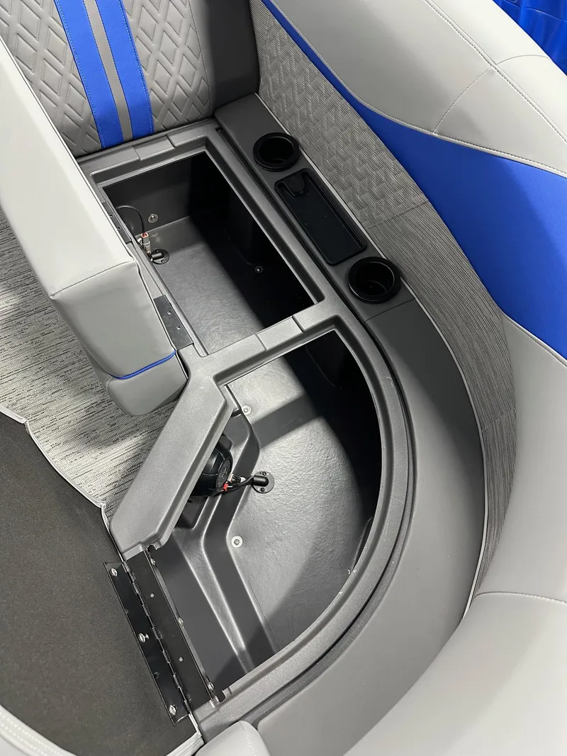 Slide: The Image of 2025 Bennington 22 MFB Tritoon interior storage and seating detail with cup holders. - 6