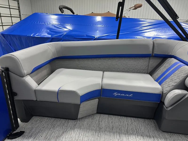 Slide: The Image of 2025 Bennington 22 MFB Tritoon interior with gray and blue seating, showcasing luxury design. - 9