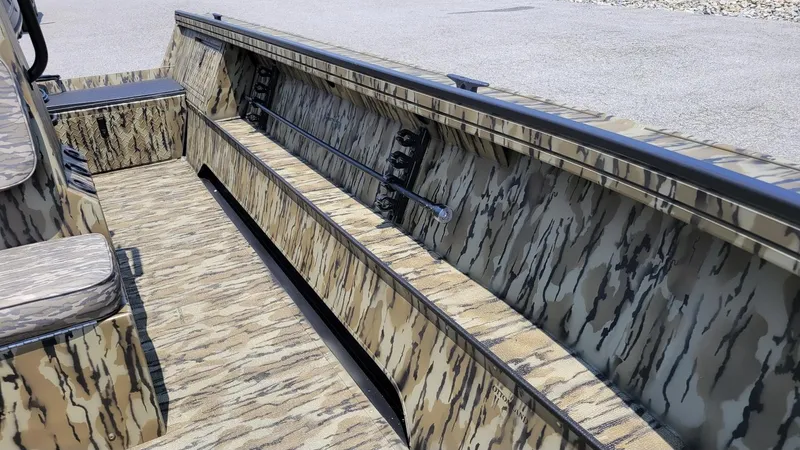 Slide: The Image of 2026 Smoker Craft Pro Sportsman 1872 CC interior with camouflage design and center console. - 12