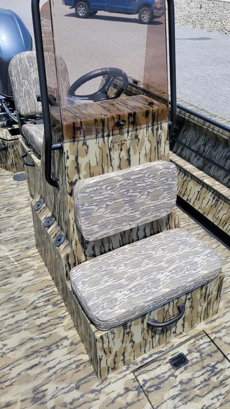Slide: The Image of 2026 Smoker Craft Pro Sportsman 1872 CC center console with camo design and Yamaha 115 hp engine. - 13