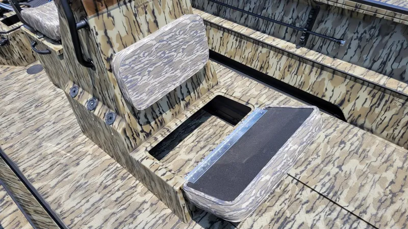 Slide: The Image of 2026 Smoker Craft Pro Sportsman 1872 CC center console with camouflage seating and storage. - 15