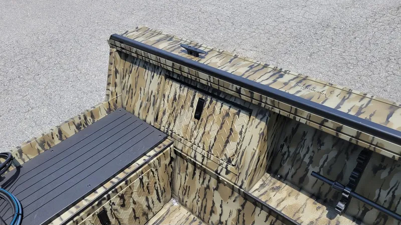 Slide: The Image of 2026 Smoker Craft Pro Sportsman 1872 CC boat with camouflage design, center console. - 19