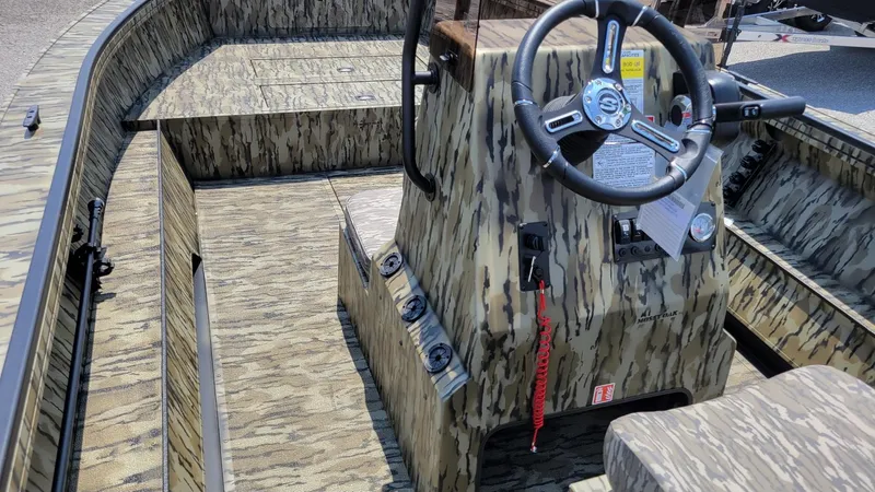 Slide: The Image of 2026 Smoker Craft Pro Sportsman 1872 CC center console boat with camo design and Yamaha 115 hp. - 23