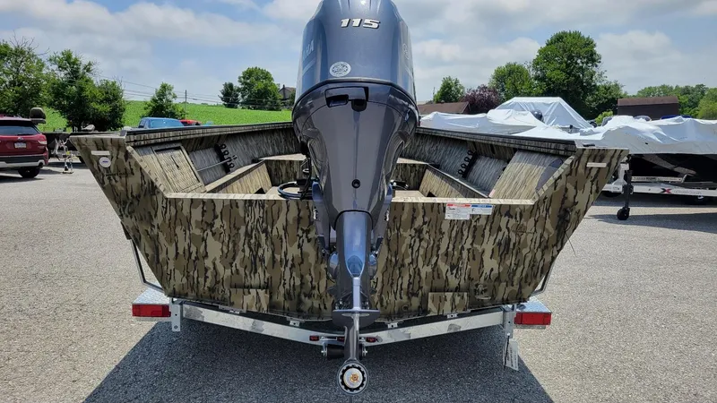 Slide: The Image of 2026 Smoker Craft Pro Sportsman 1872 CC with Yamaha 115 hp engine, camo design, on trailer. - 5