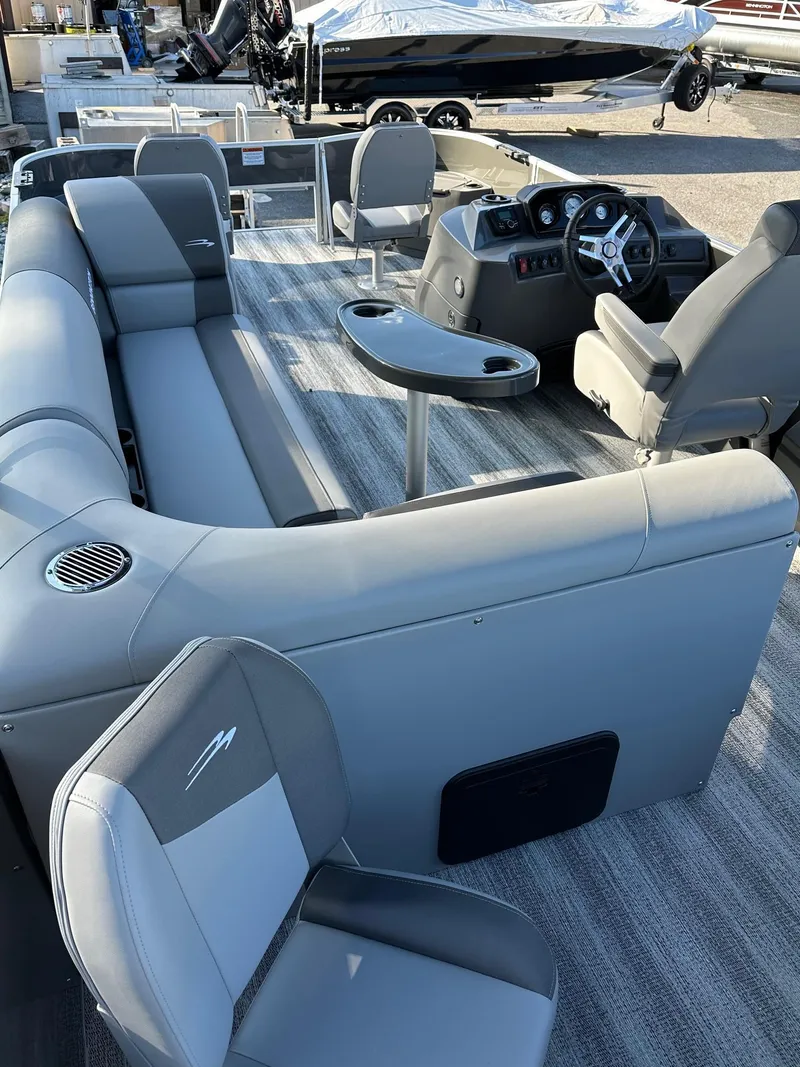 Slide: The Image of 2025 Bennington 21 SF Family boat interior with seating and steering console. - 10