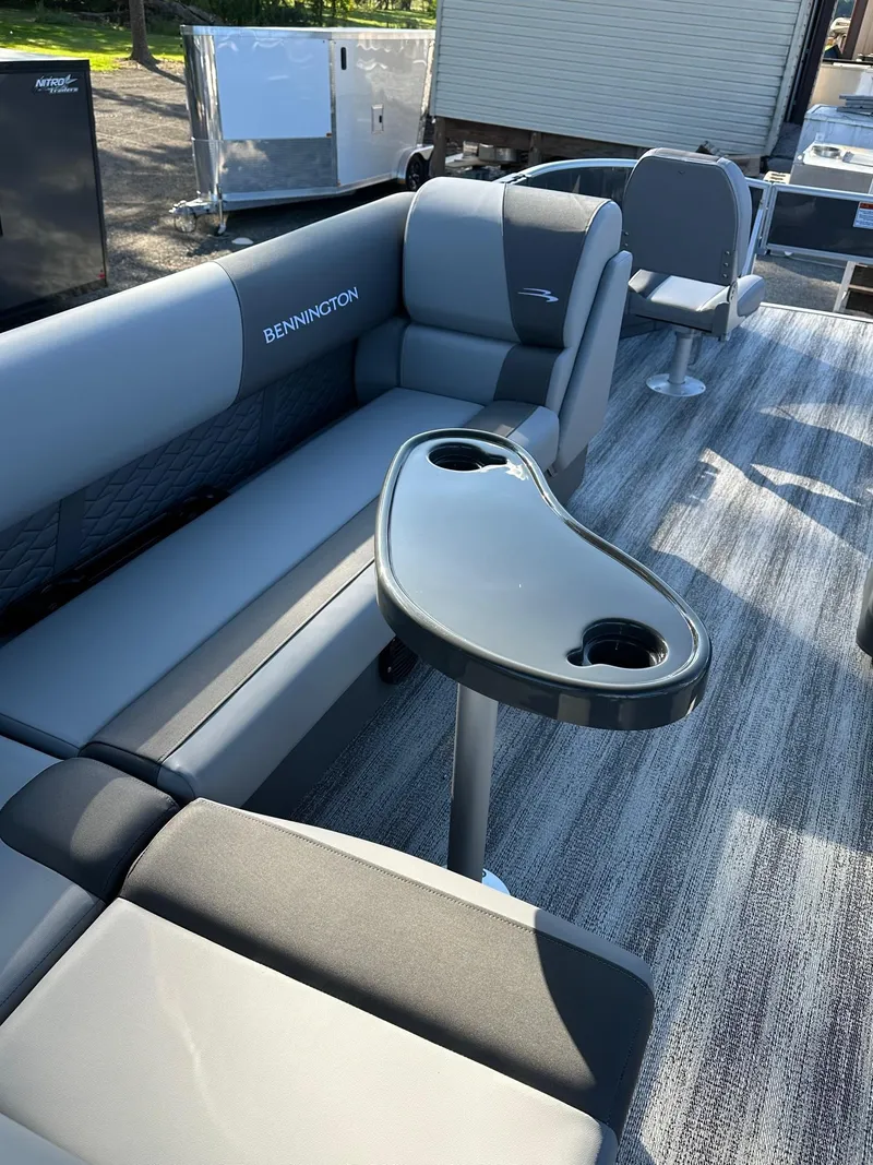 Slide: The Image of 2025 Bennington 21 SF Family boat interior with seating and table, ideal for fishing. - 18