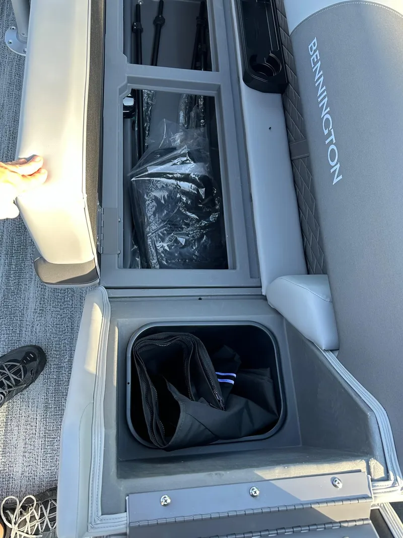 Slide: The Image of 2025 Bennington 21 SF boat storage compartments with fishing gear and accessories. - 19