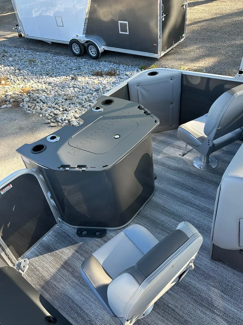 Slide: The Image of 2025 Bennington 21 SF Family boat interior with fishing seats and storage compartments. - 23
