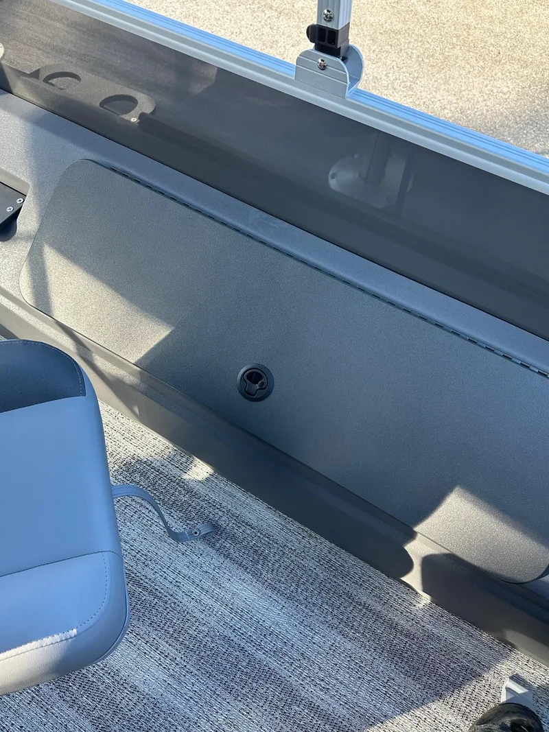 Slide: The Image of 2025 Bennington 21 SF Family boat interior with fishing seat and storage compartment. - 26