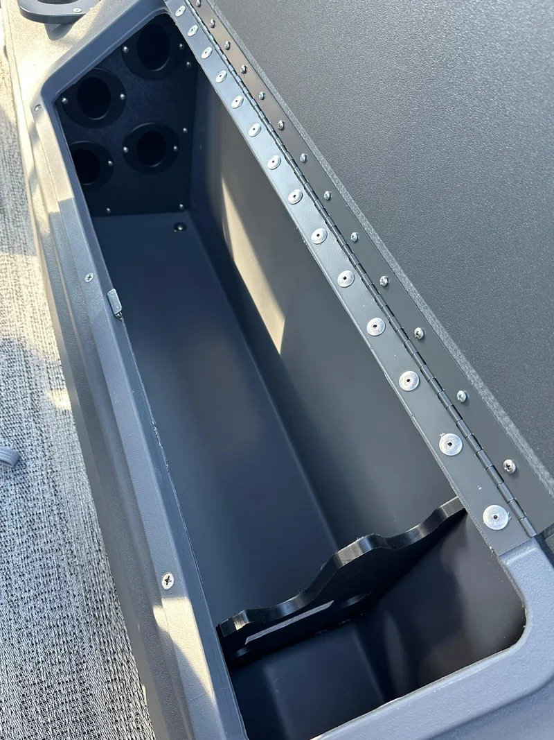 Slide: The Image of 2025 Bennington 21 SF Family boat storage compartment with fishing rod holders. - 27