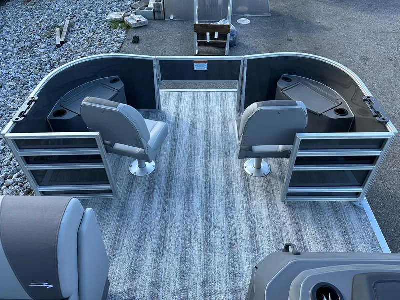 Slide: The Image of 2025 Bennington 21 SF Family boat with four fishing seats, gray interior, and storage compartments. - 28