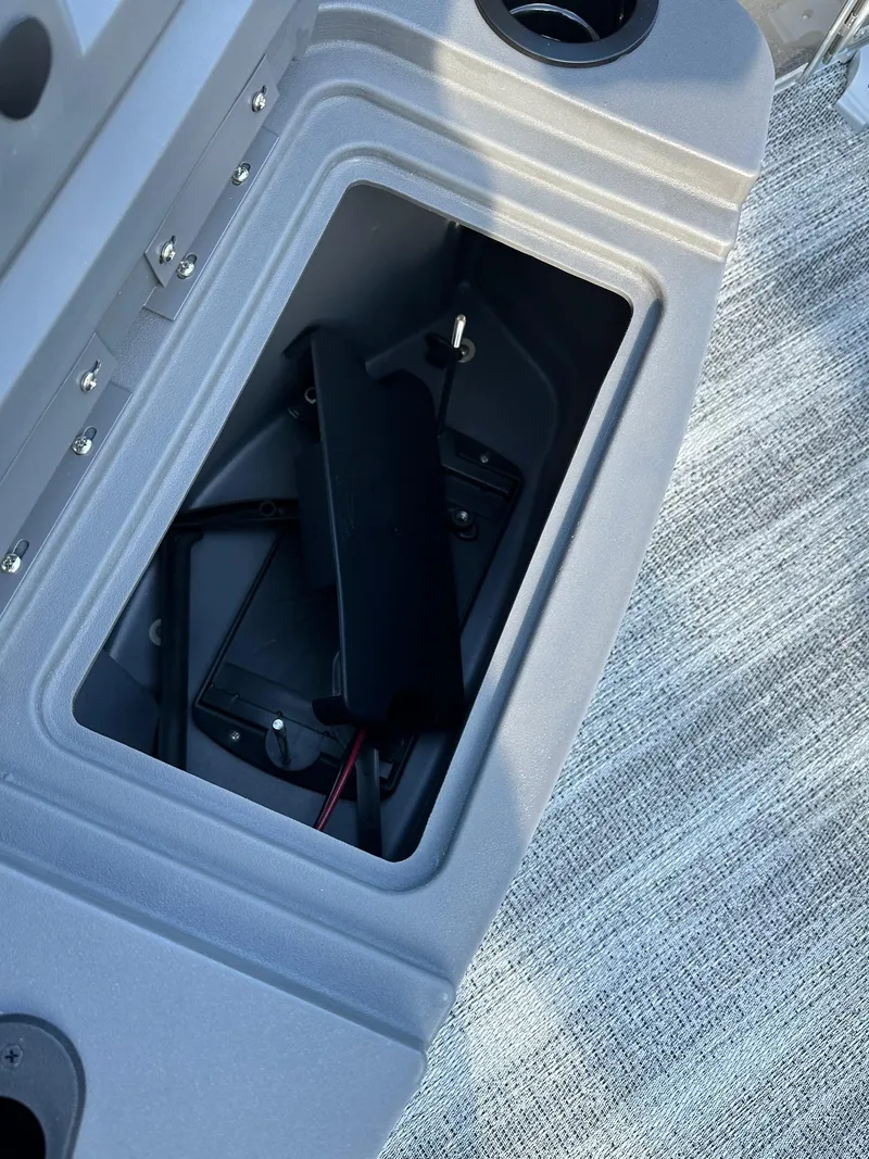 Slide: The Image of Storage compartment in 2025 Bennington 21 SF Family boat, featuring a fishing seat setup. - 4