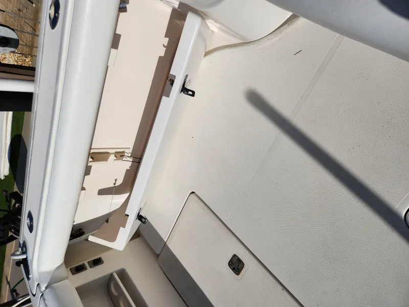 Slide: The Image of 2004 Tiara Yachts 38 Open interior deck with storage compartments. - 12