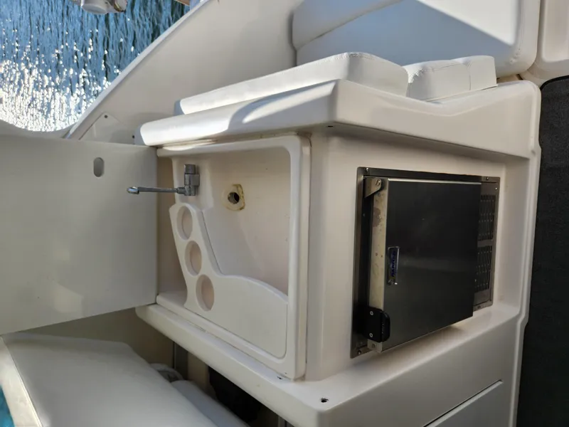 Slide: The Image of 2004 Tiara Yachts 38 Open interior with seating and storage compartments. - 14