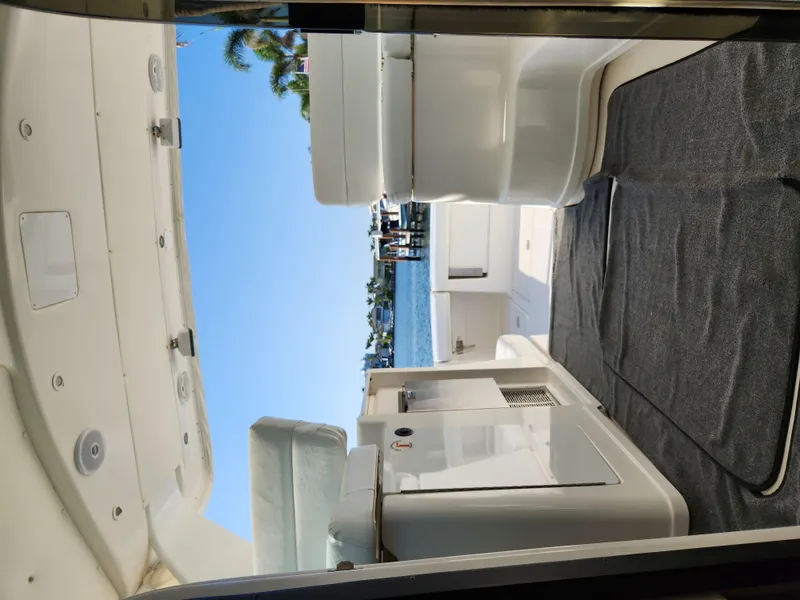 Slide: The Image of 2004 Tiara Yachts 38 Open interior with ocean view and seating area. - 22