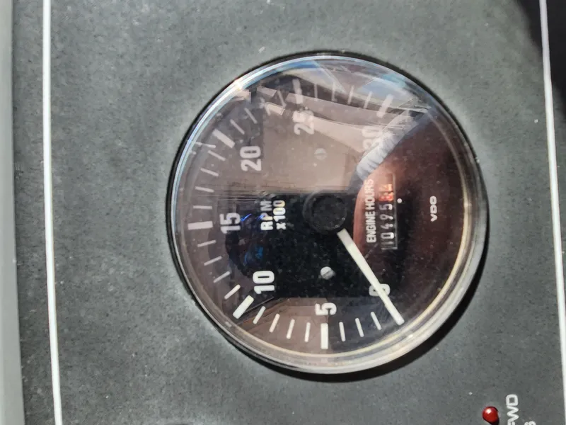 Slide: The Image of Close-up of a Tiara Yachts 38 Open 2004 tachometer showing engine hours and RPM. - 29