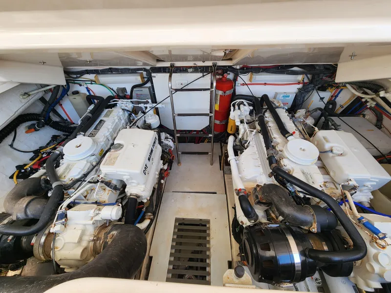 Slide: The Image of Engine room of 2004 Tiara Yachts 38 Open, featuring dual engines and fire extinguisher. - 32