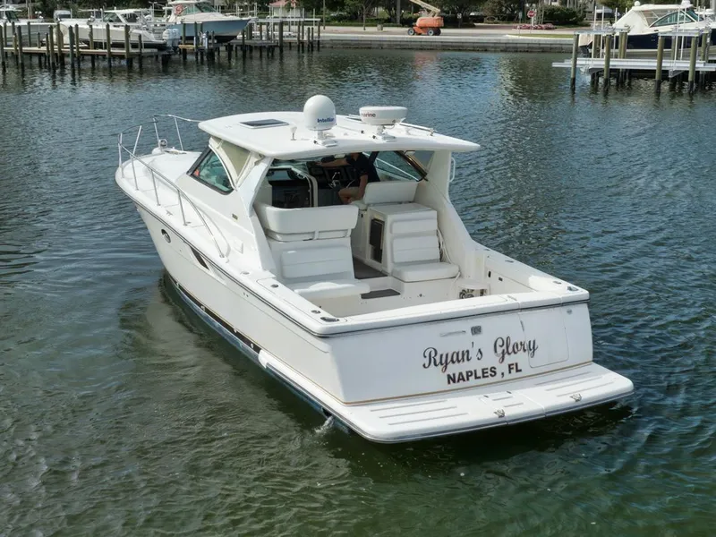 Slide: The Image of 2004 Tiara Yachts 38 Open boat on water, labeled "Ryan's Glory," Naples, FL. - 33