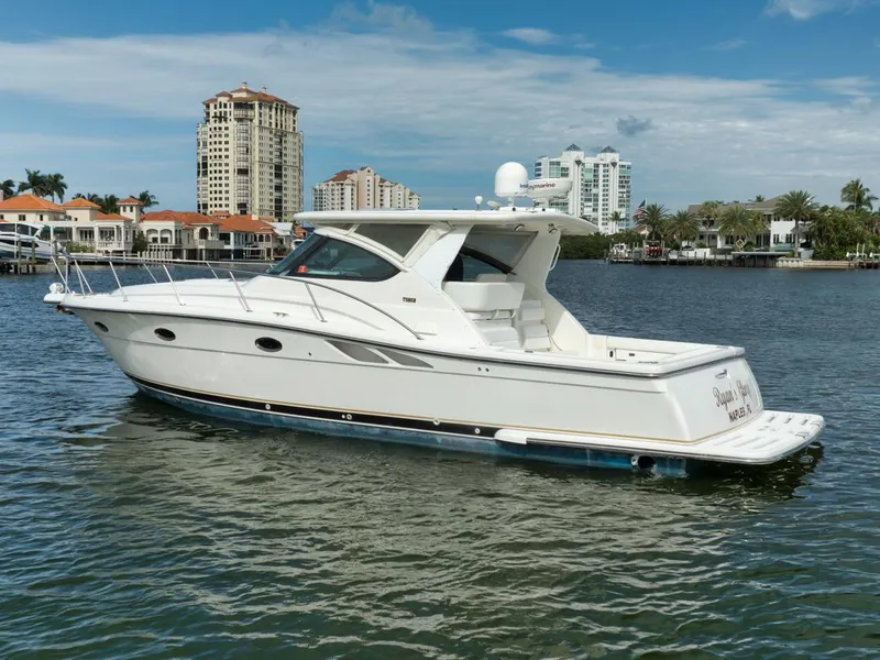 Slide: The Image of 2004 Tiara Yachts 38 Open boat on water, with cityscape background. - 36