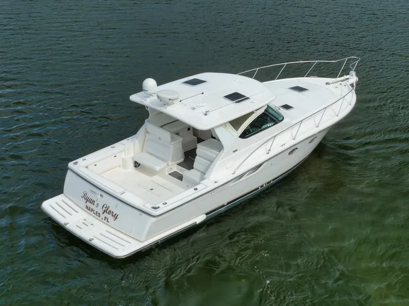 Slide: The Image of 2004 Tiara Yachts 38 Open cruising on water, rear view. - 39