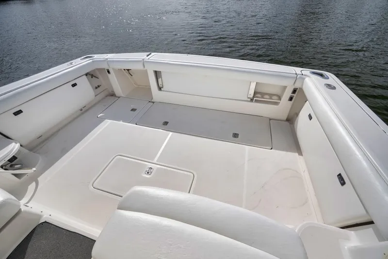 Slide: The Image of 2004 Tiara Yachts 38 Open boat deck with spacious seating and storage. - 4