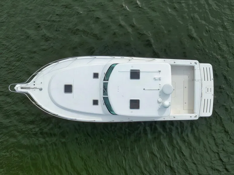 Slide: The Image of Aerial view of 2004 Tiara Yachts 38 Open on water. - 41